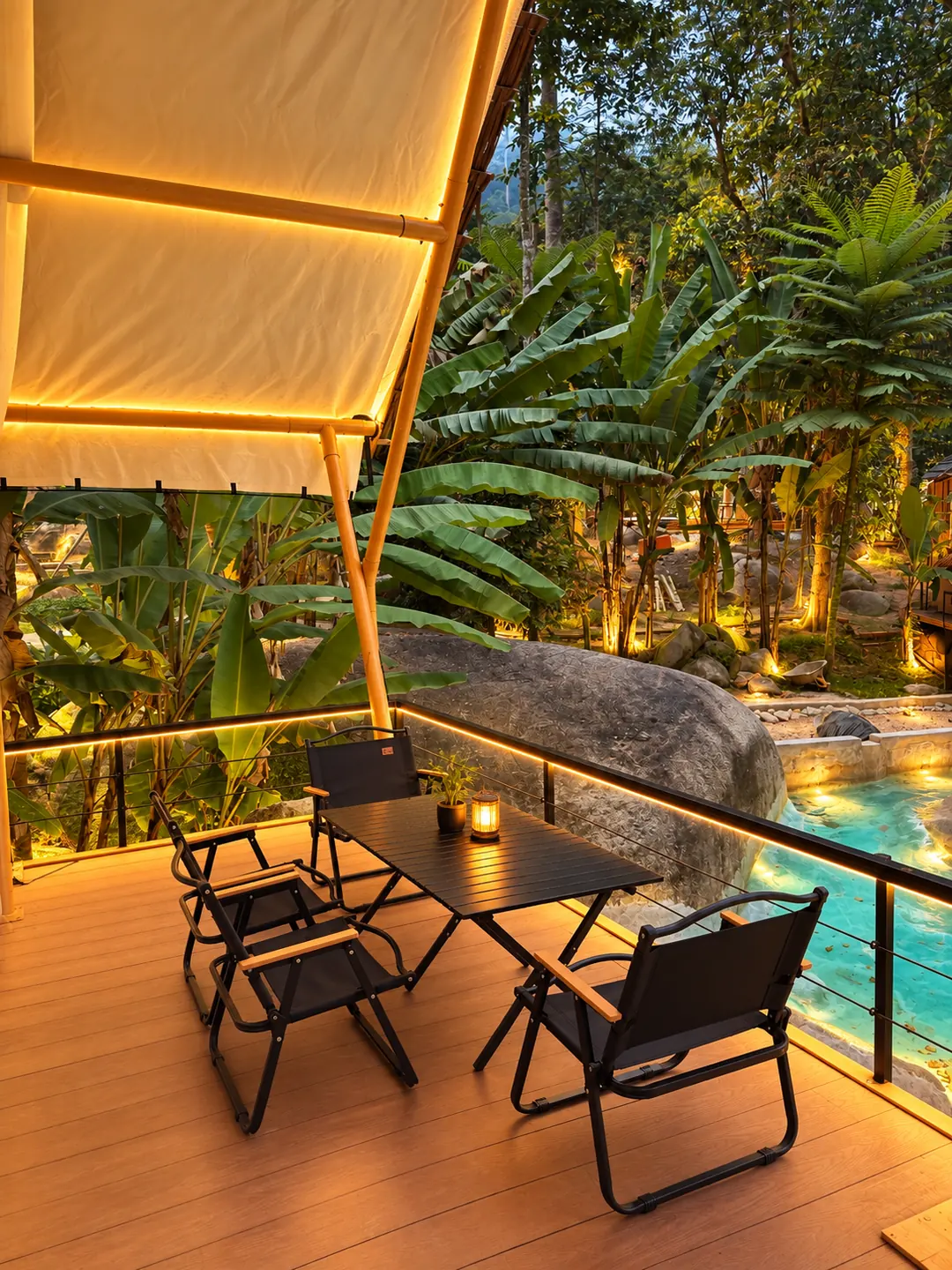 Glamping terrace with outdoor seating beside tropical greenery